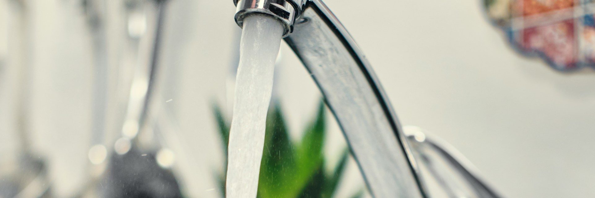 Clear water running from a kitchen faucet